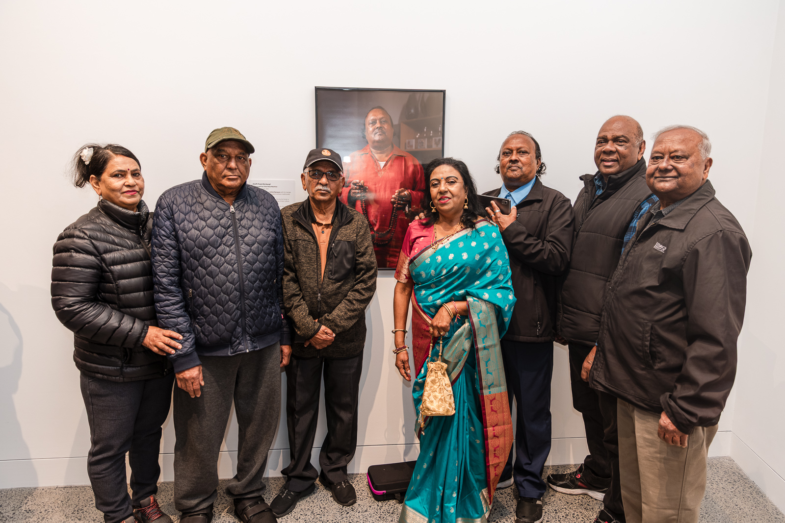 Community attending a art exhibition.