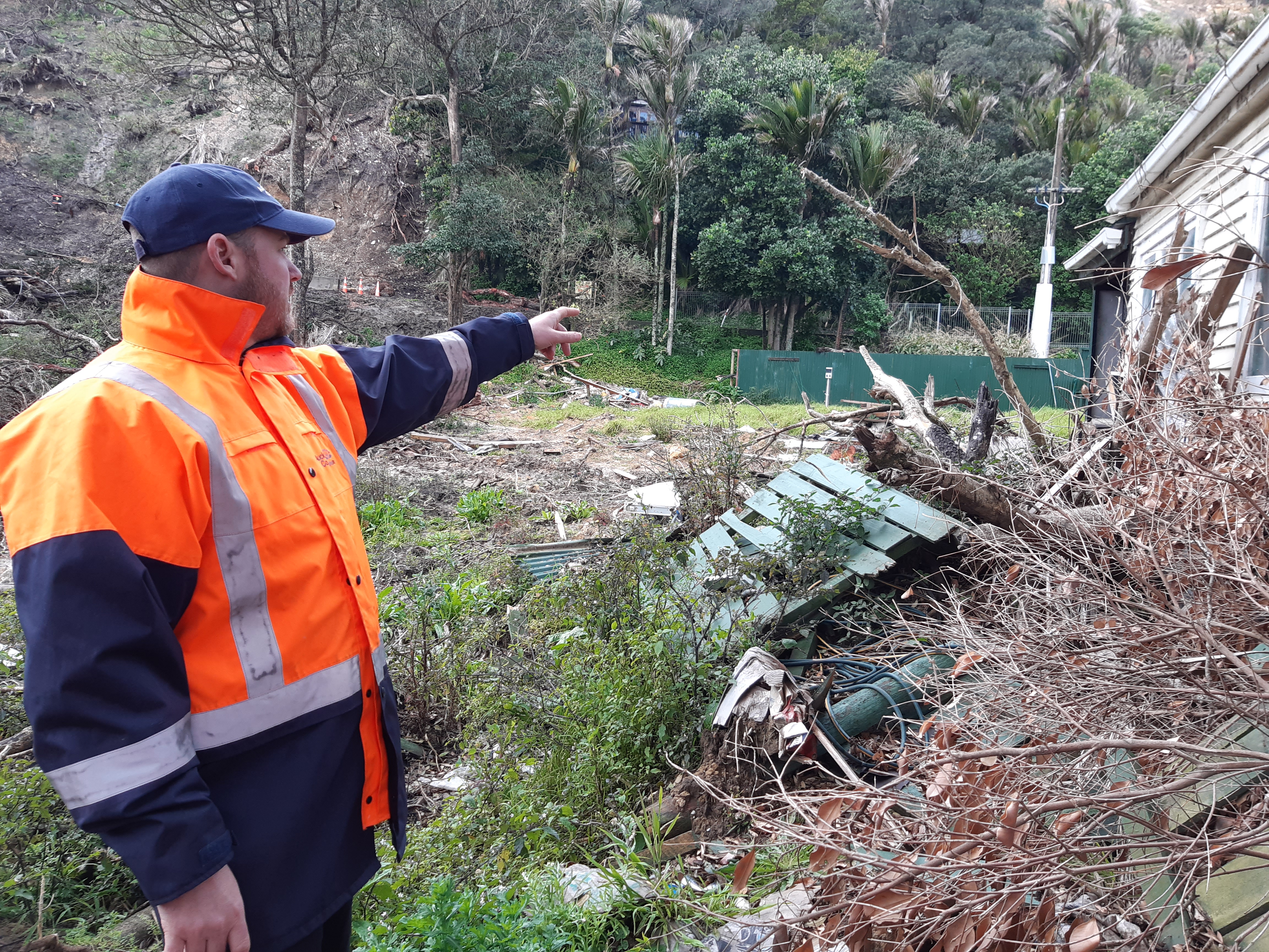 A guy next to rubble. 