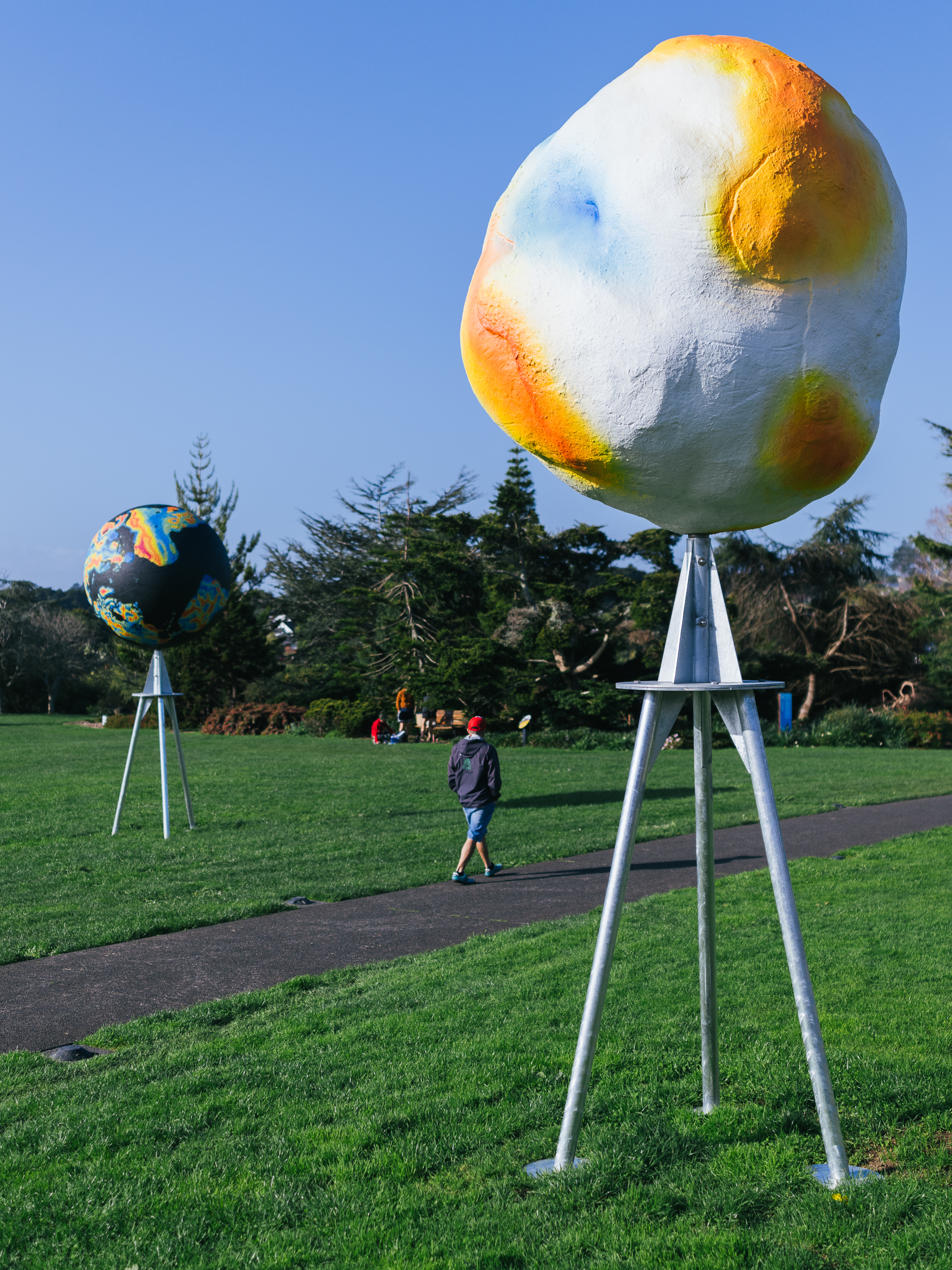 Otherworlds yellow and white artwork.