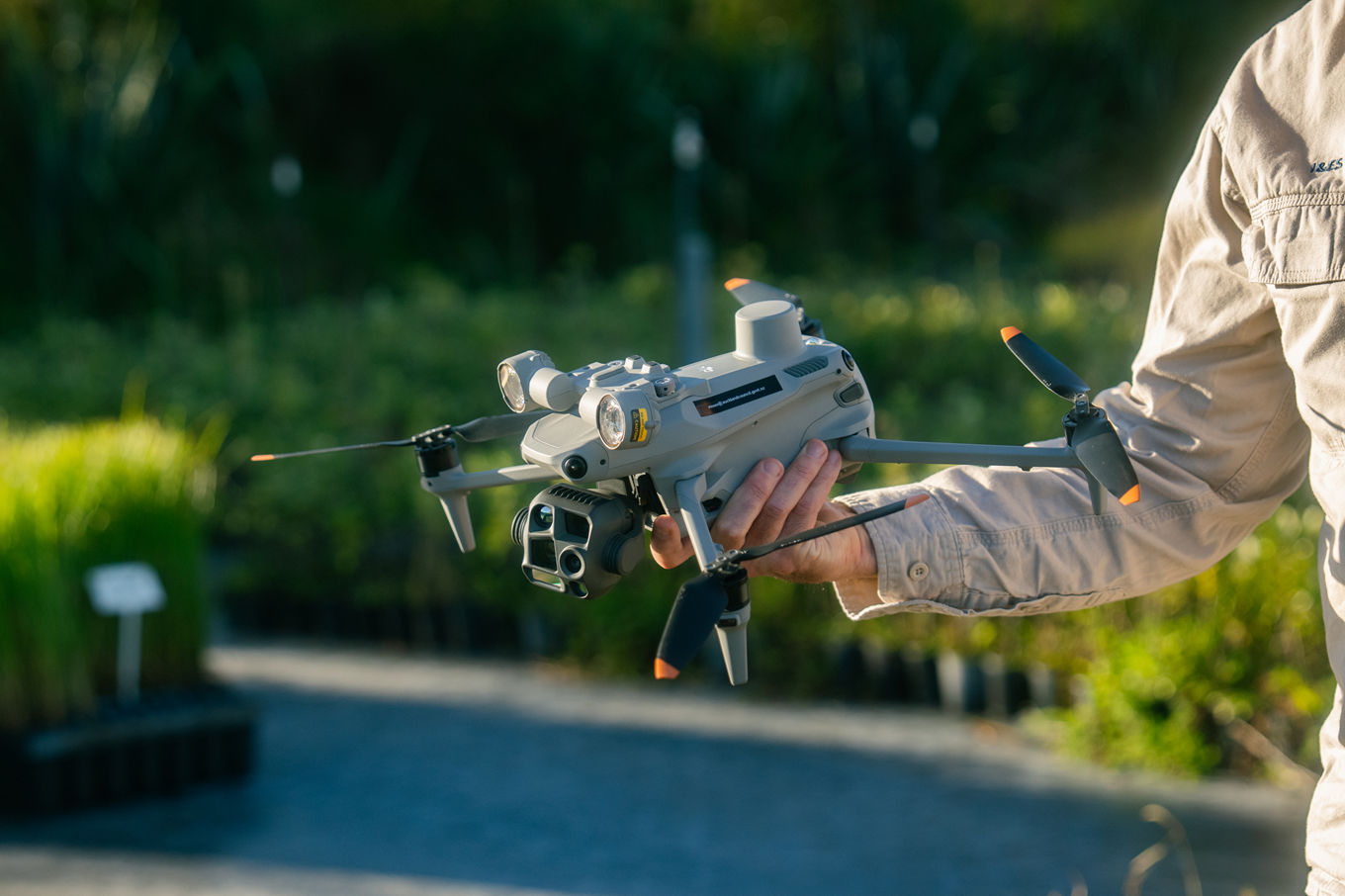 A drone in a person's hand.