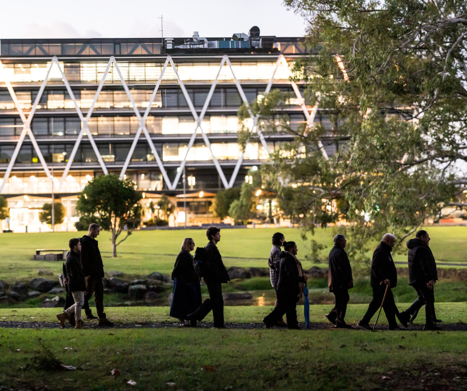 A nice view of the park featuring a calm pond area.