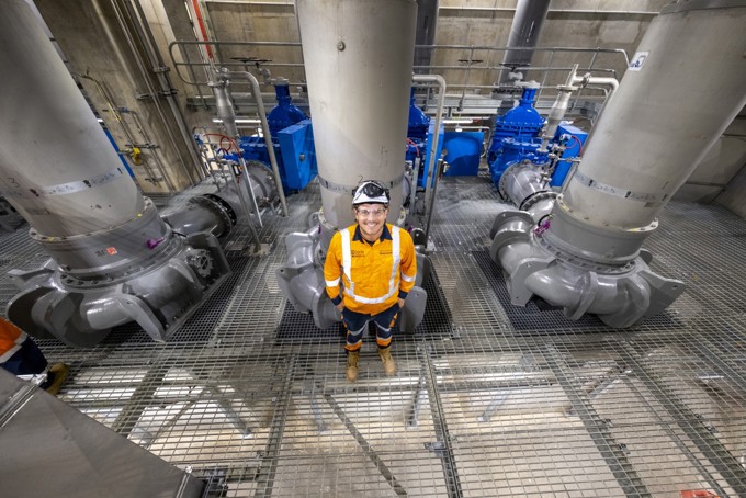 Engineer Stands In Front Of Pumps Which Send Watercare's Central Interceptor Tunnel Flows To Treatment Plant
