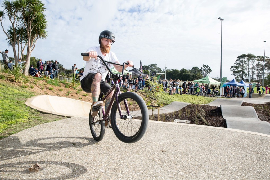 A Guy Riding A Bike