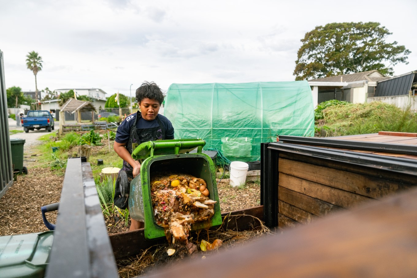 Child doing compost.