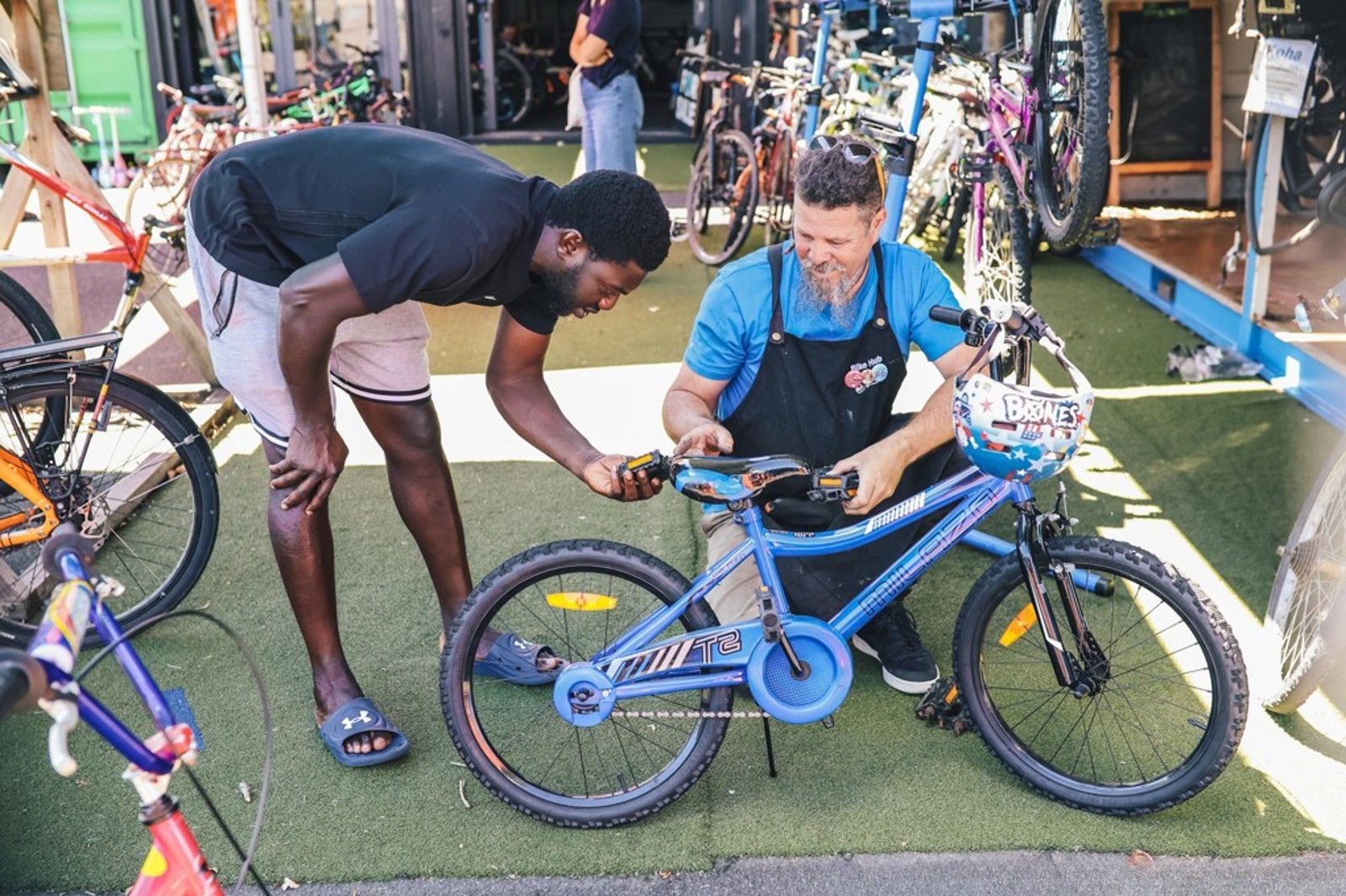 A guy fixing a bike.