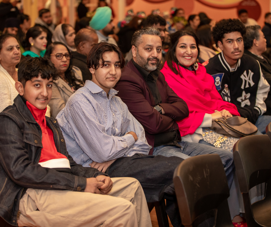 Family at community cultural event. 