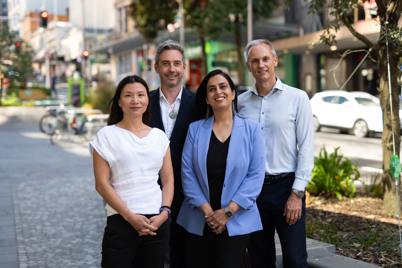 Auckland Council and Auckland Transport staff standing on Quay St. 