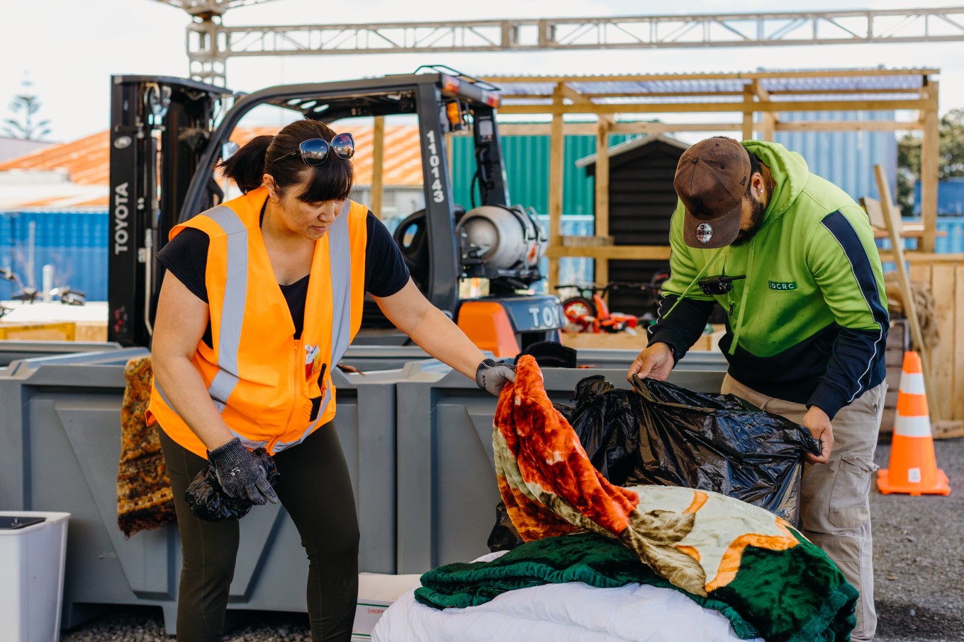 People sorting through trash. 
