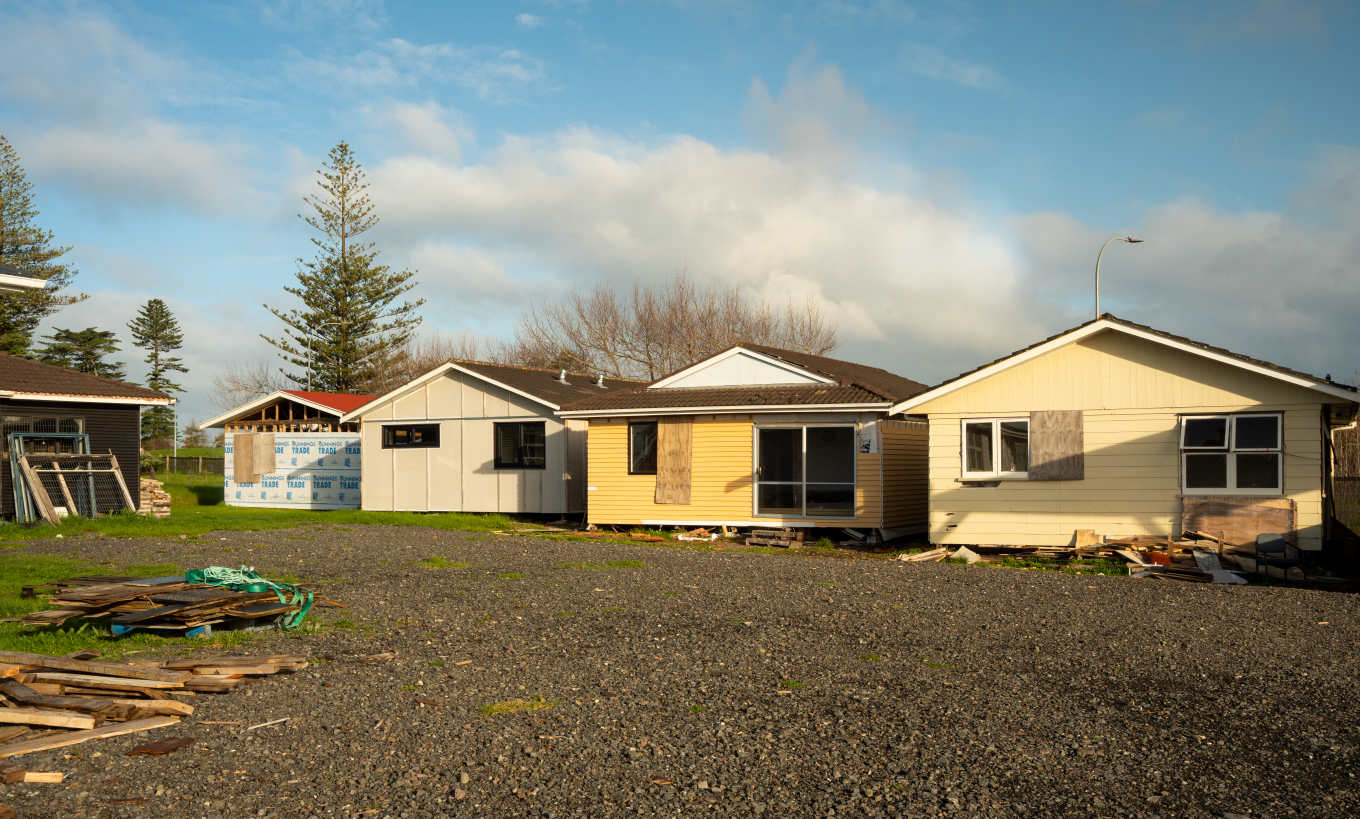A collection of houses being built.