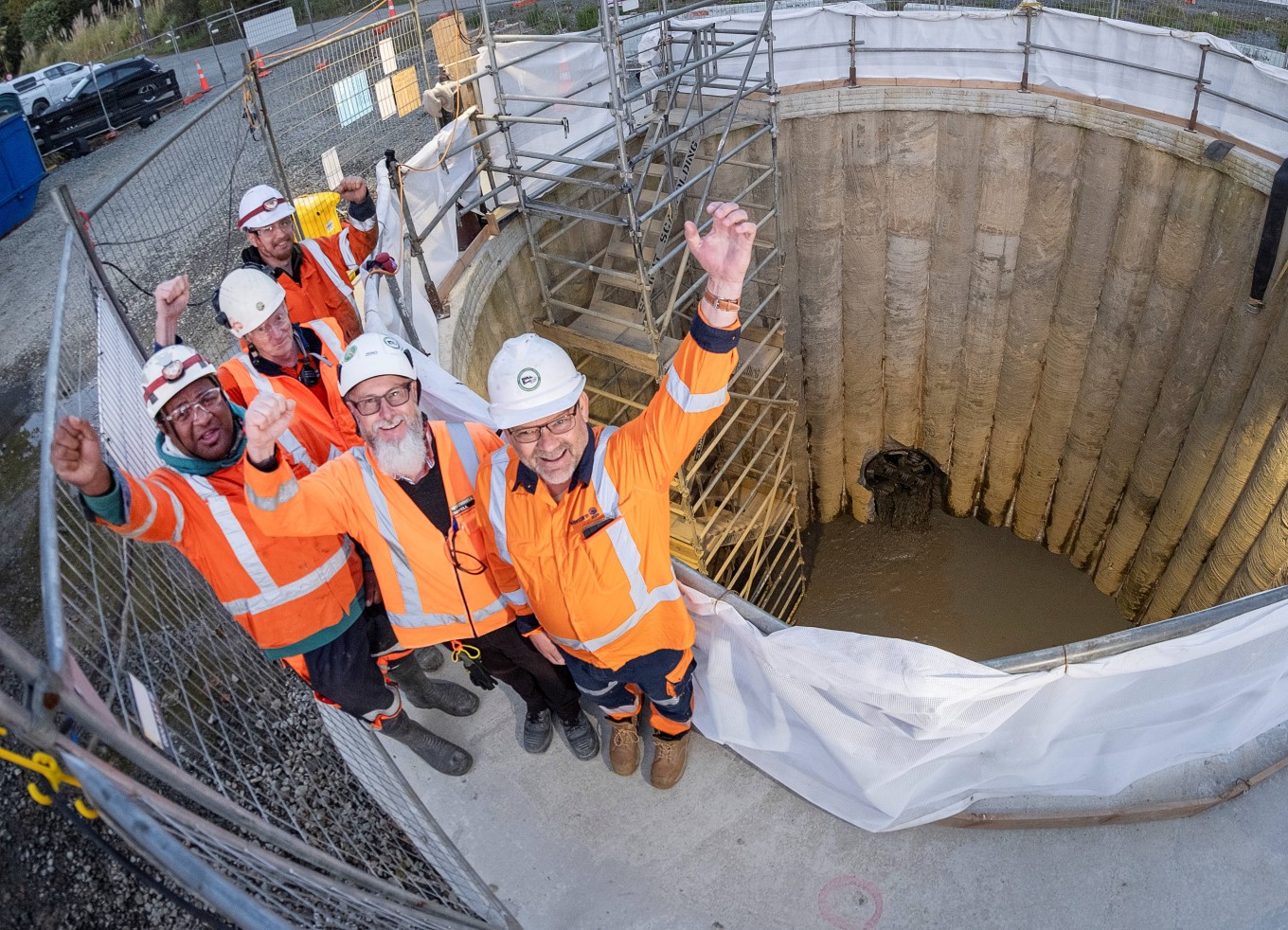 Watercare and Mcconnell Dowell celebrate Piper frill machine's final breakthrough.