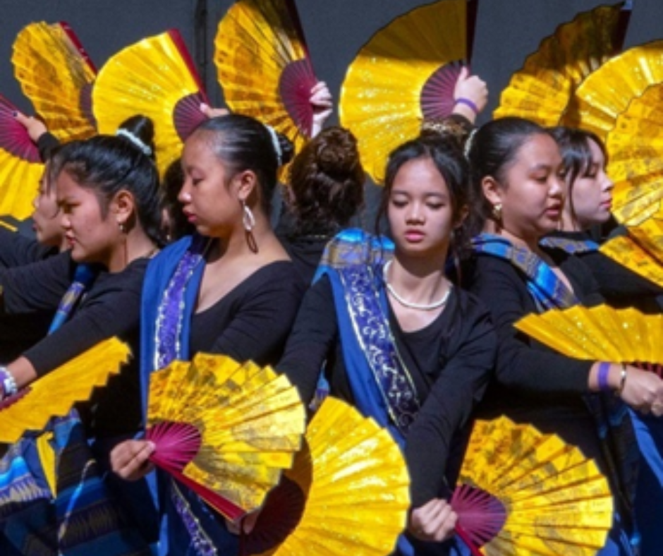 Performers dancing with fans. 