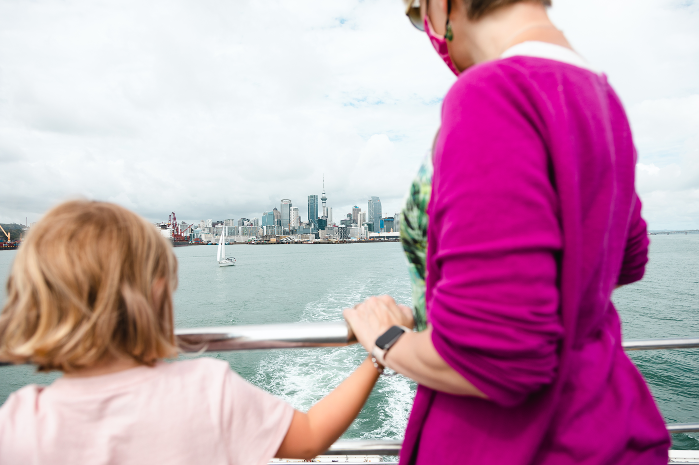 A lady and a little girl overlooking the harbour. 