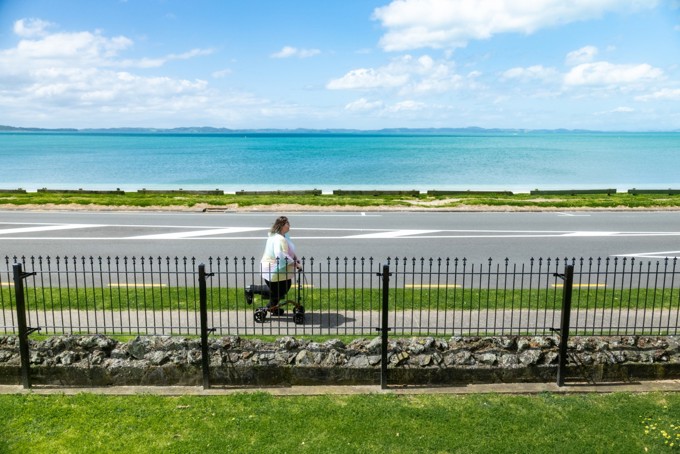 A Lady On A Push Scooter