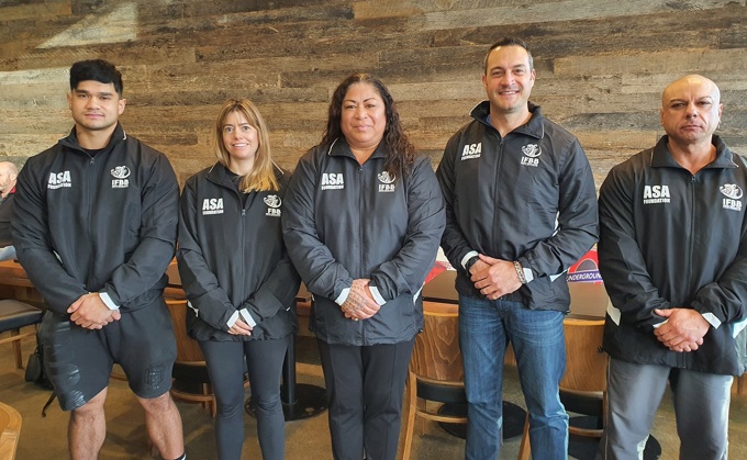 Grant helps team dress for success