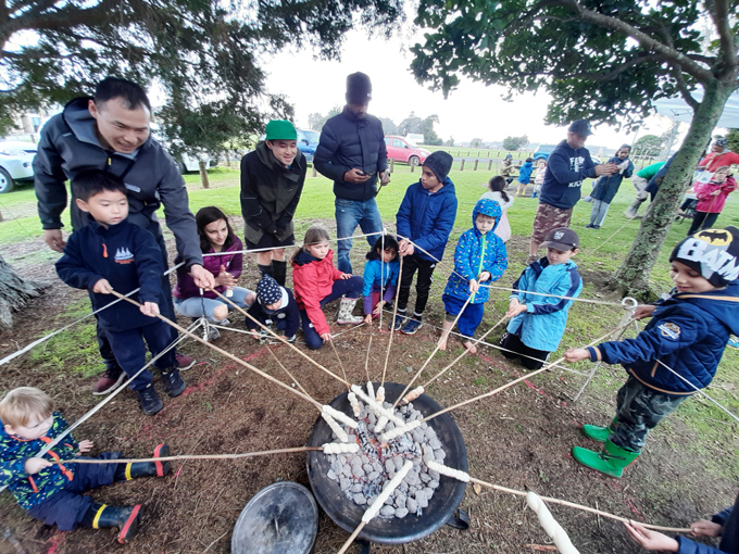 Wild Child Making Bush Donuts Over A Fire Web