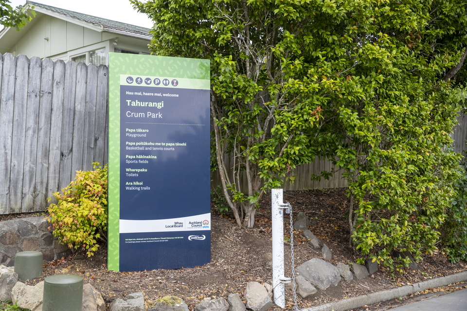 A park sign welcoming people to Tahurangi Crum Park. 