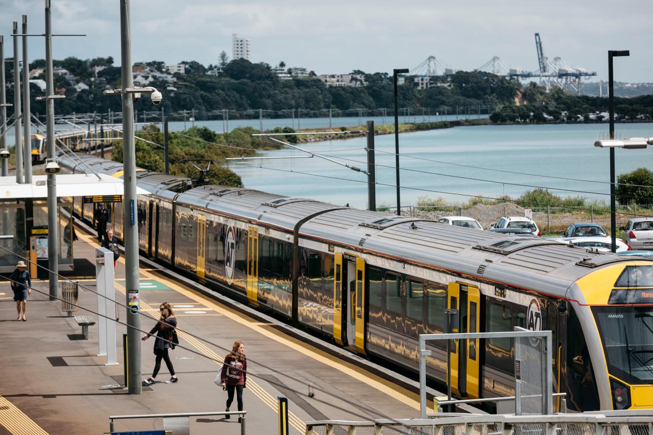 An electric train arriving to a train station on the City Rail Link network. 