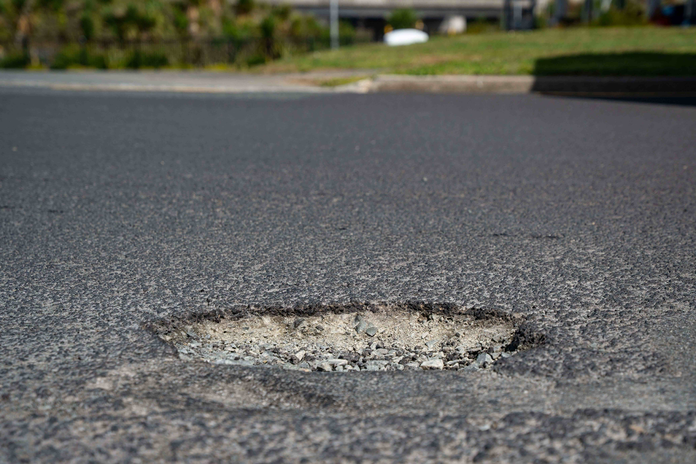 A pothole in the street. 