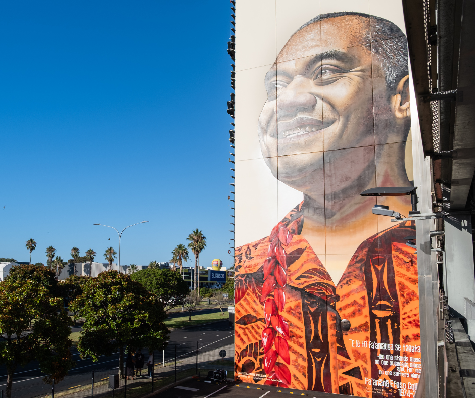 Mural of Efeso Collins on building.