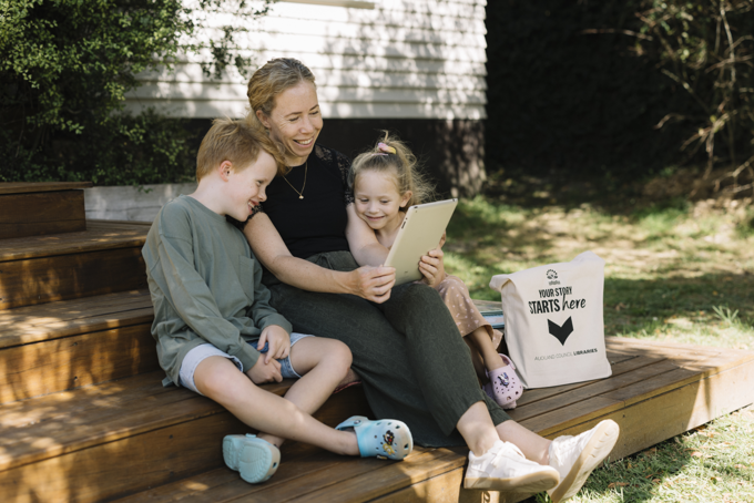 A family on the porch reading a ebook