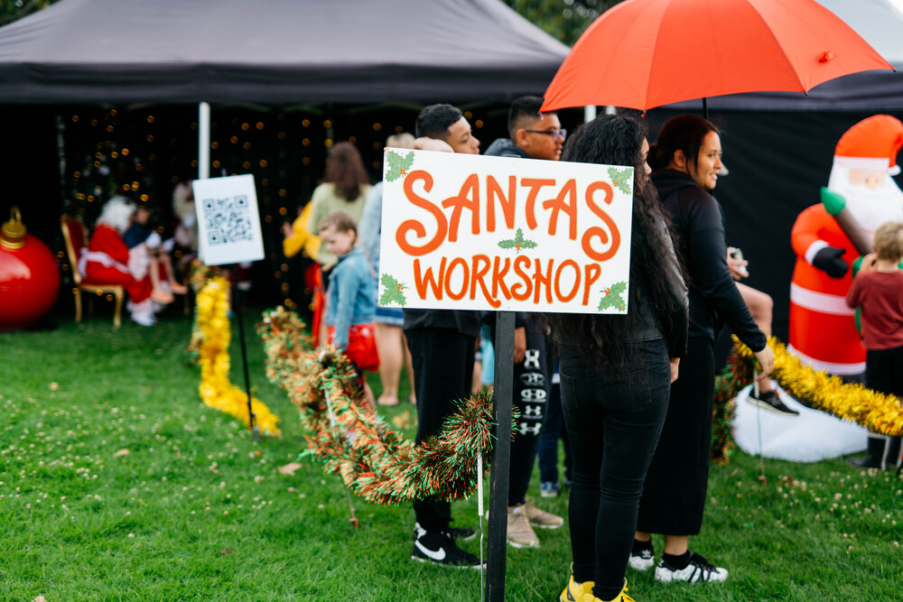 A Santa's Workshop sign. 