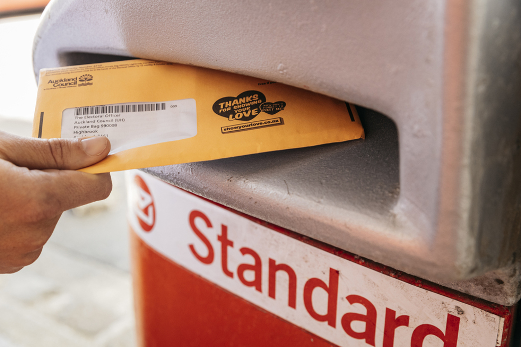 An envelope in a post box