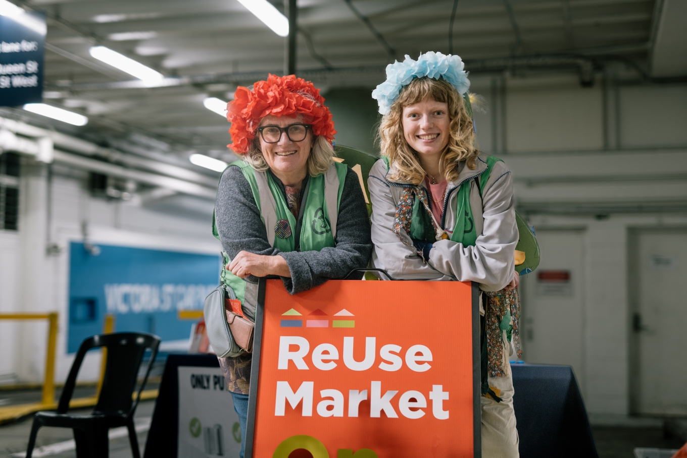 Two ladies standing by the Reuse Market.