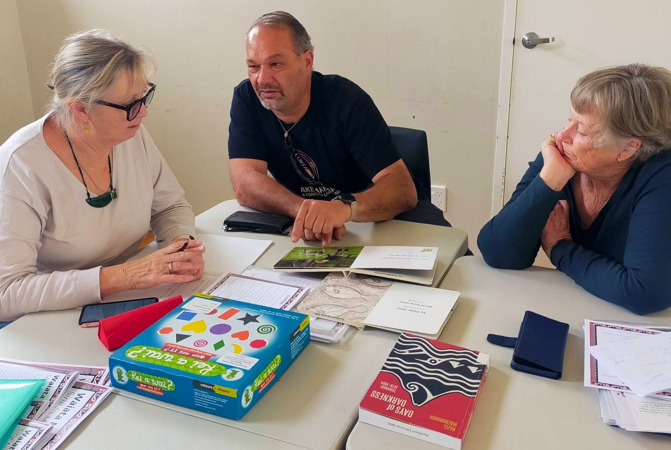 A group of people learning Te Reo. 