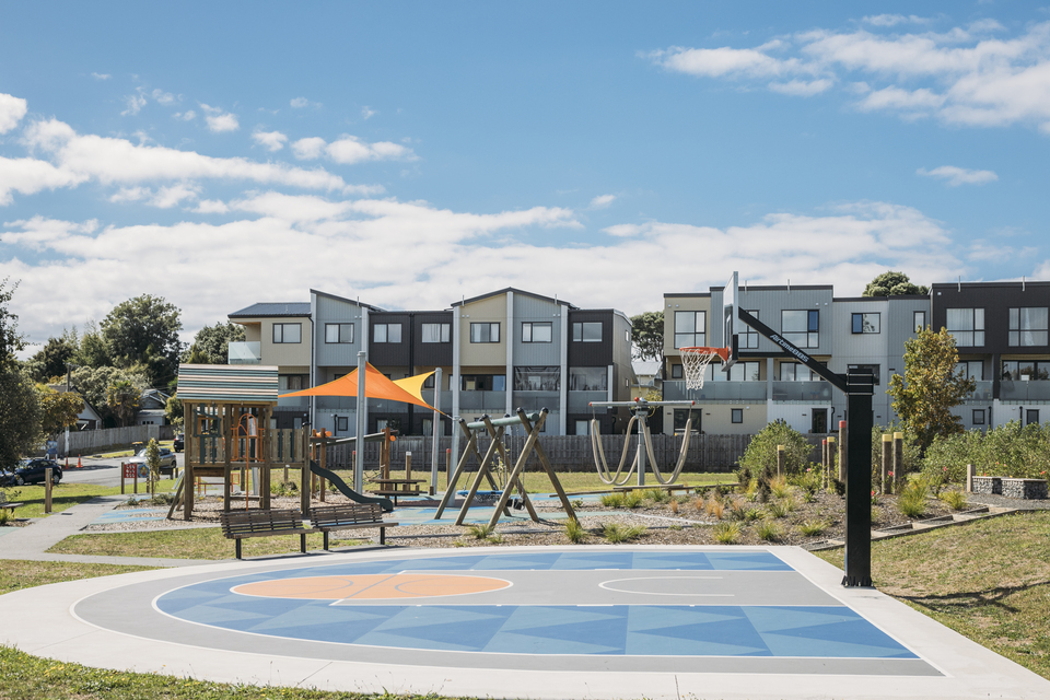 A local playground and a basketball court. 