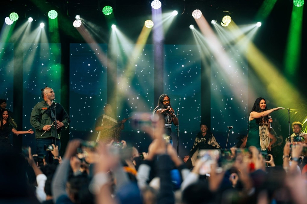People performing on stage for a festival