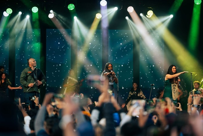 People performing on stage for a festival