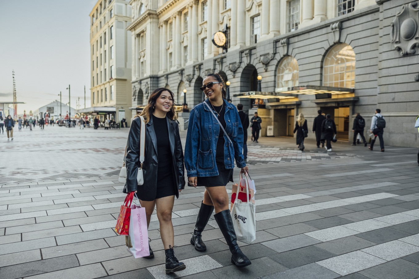 Two ladies walking around Te Komititanga square.