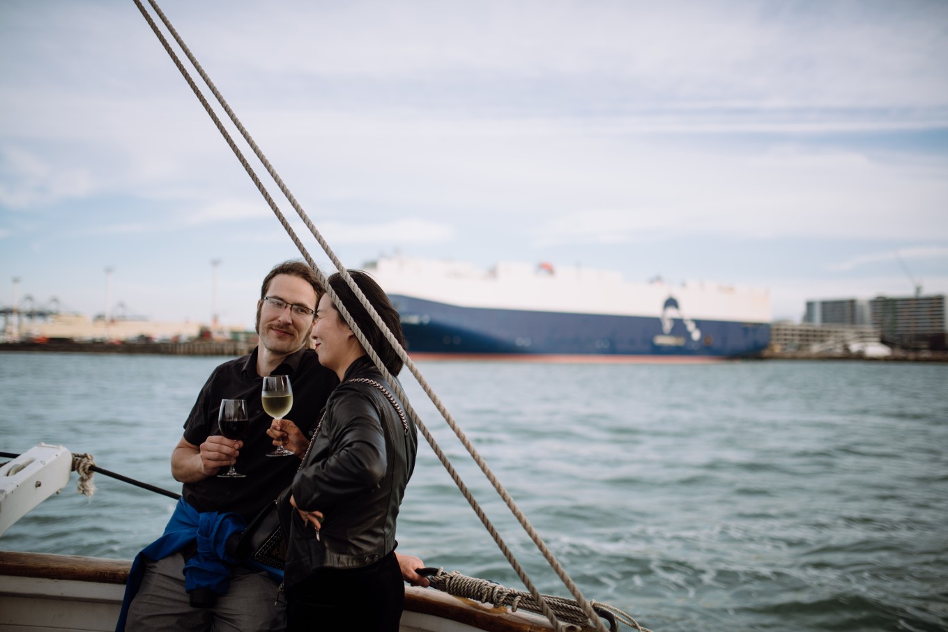 A man and woman sailing on a boat. 