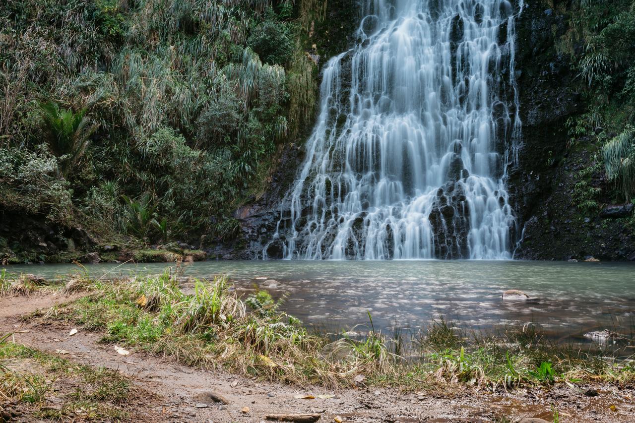 A waterfall and the lake area below it. 