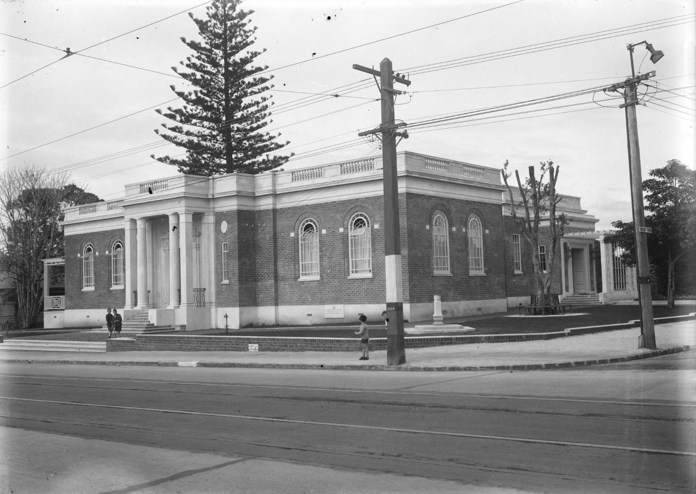An old black and white photo of a Neo-Georgian style building