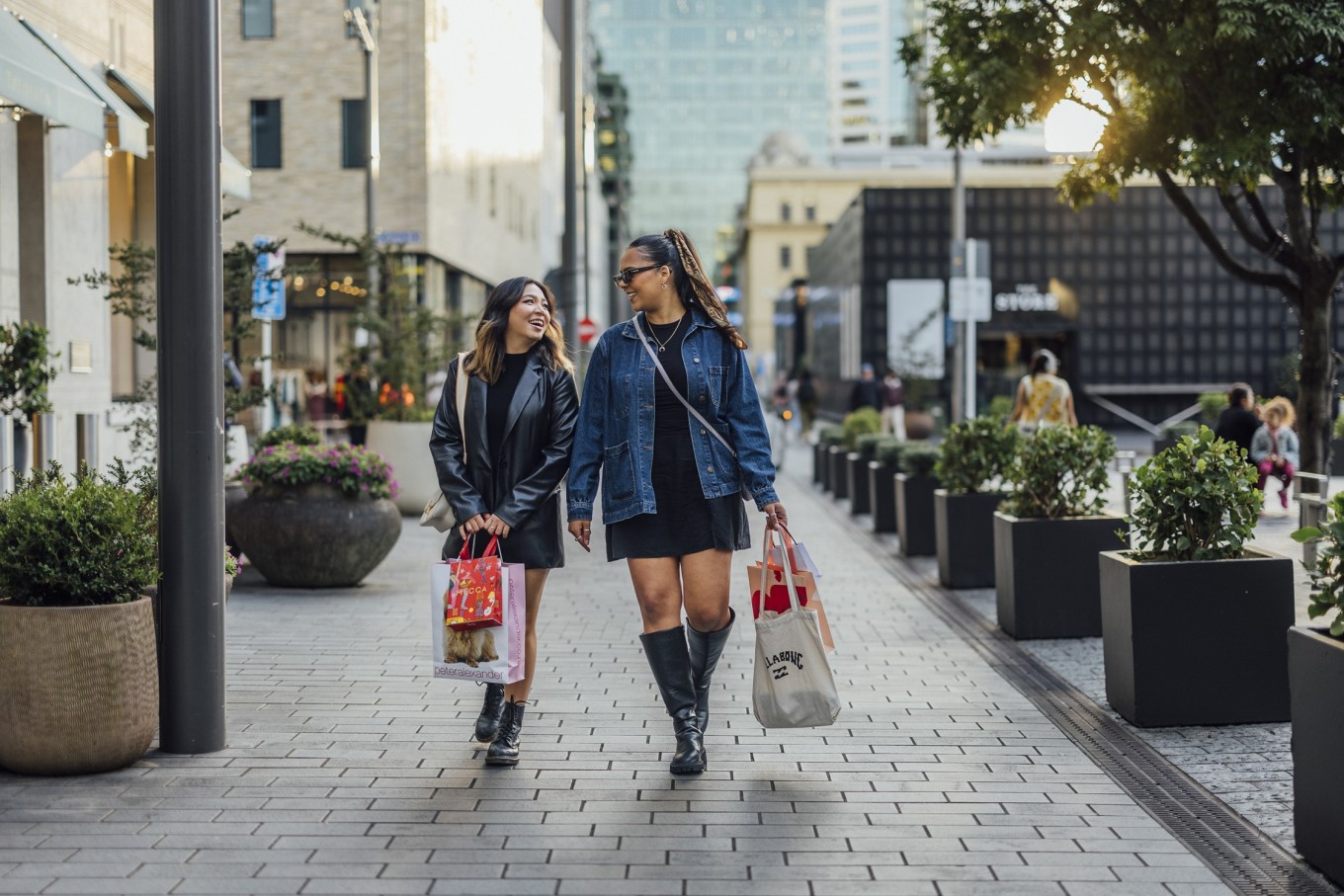 Two ladies walking down Galway St.