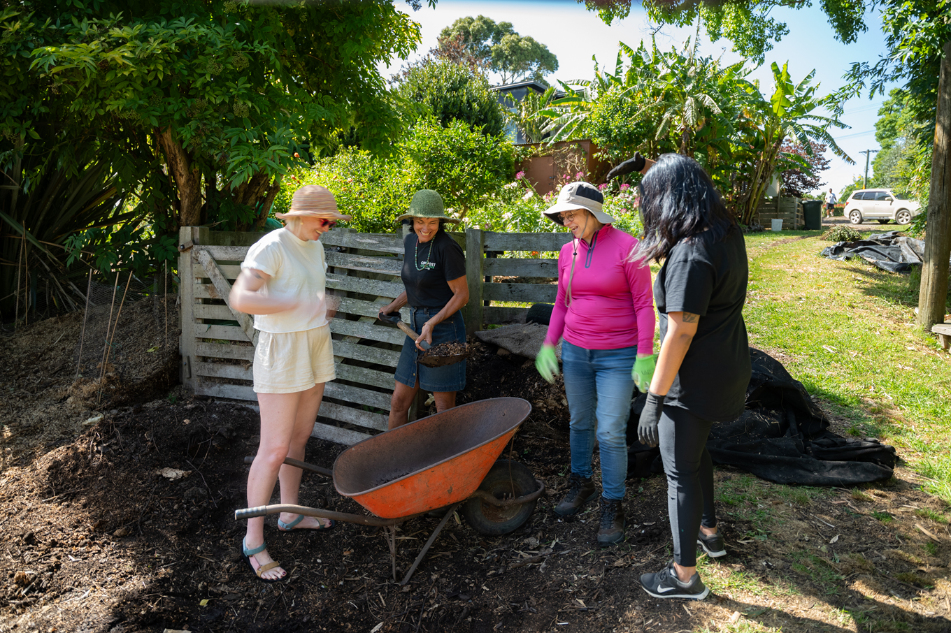 A group of people learning how to compost. 