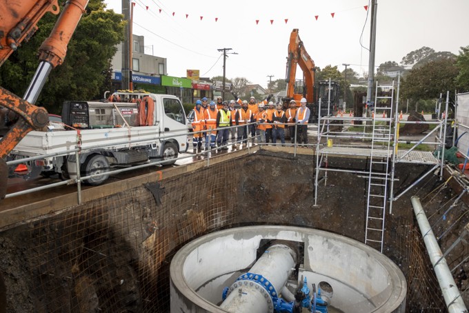 The Ground Crew Stands Above The Line Valve Chamber Installed On Duke St For The Huia 1 Pipeline.