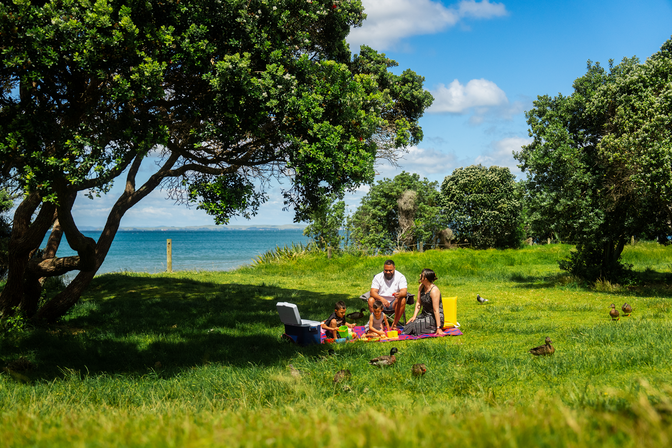 A family having a picnic at Long Bay. 