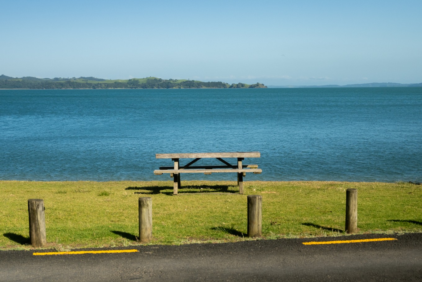 A park bench by the water.