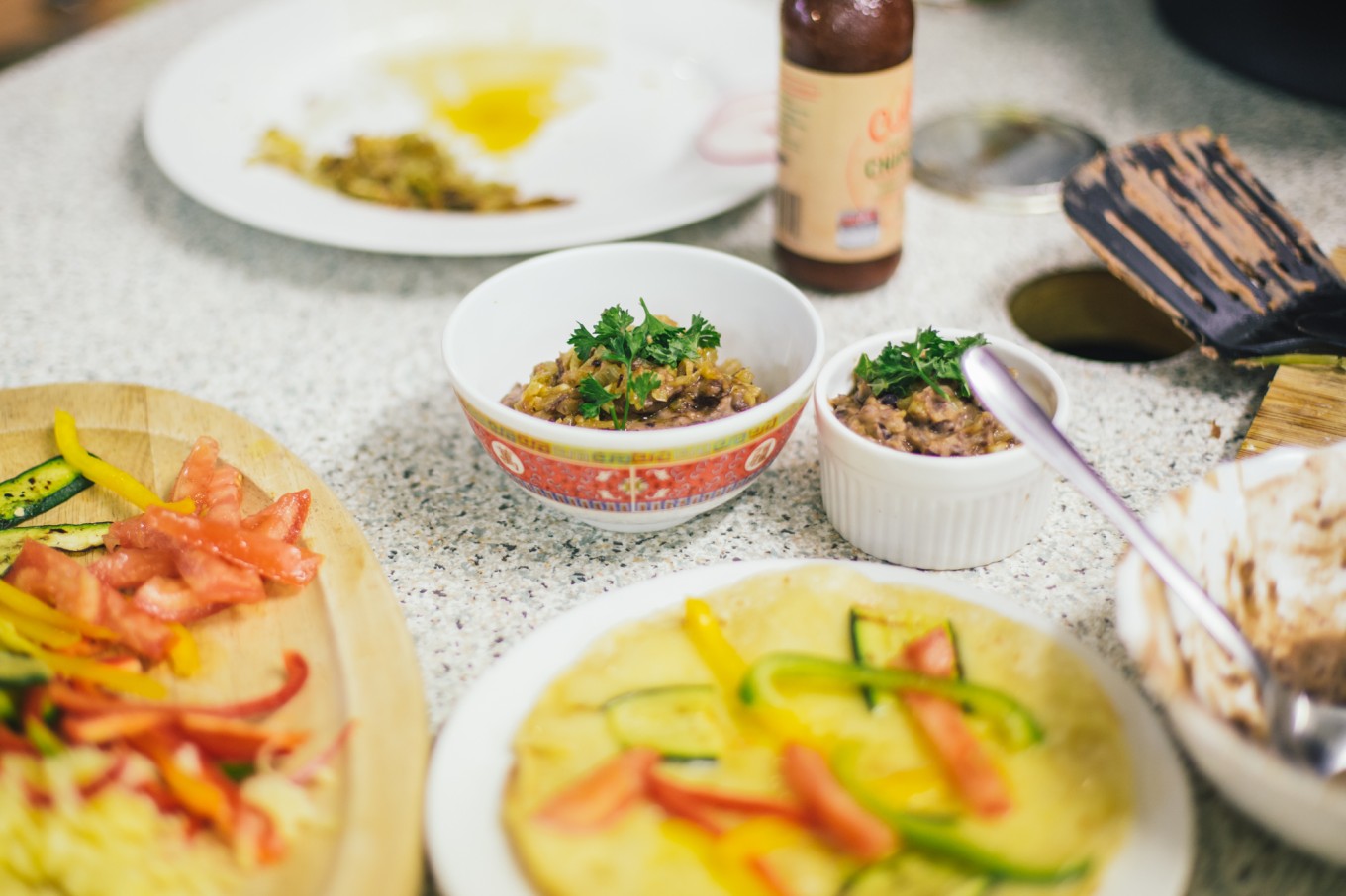 A collection of food including rice and curries.