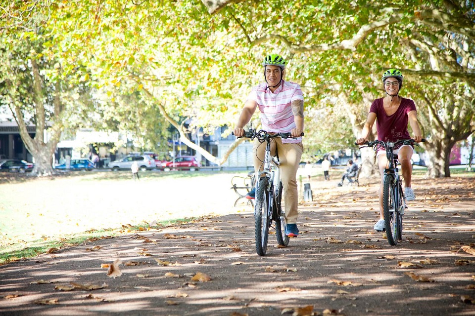 People riding bikes in the park.