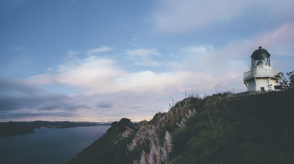 A lighthouse on a cliffside.
