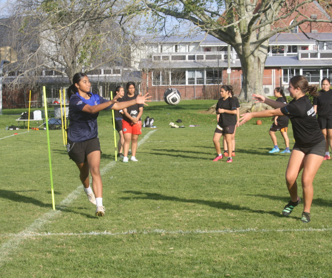Young ladies playing rugby