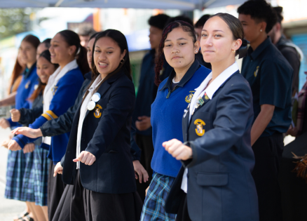 Schoolgirls doing kapahaka. 