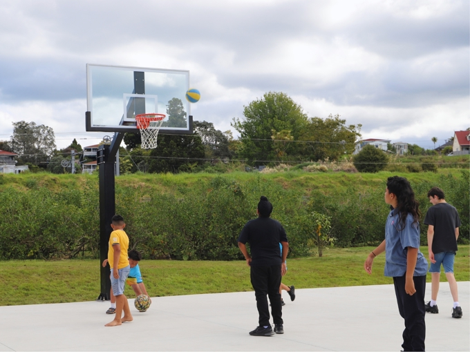 The Playground Is Equipped With A Basketball Half Court.