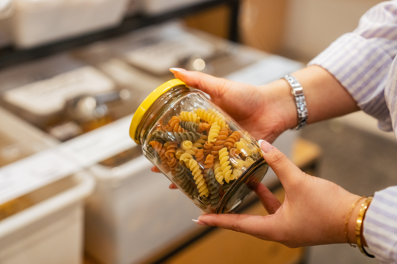 A collection of pasta in a glass jar. 