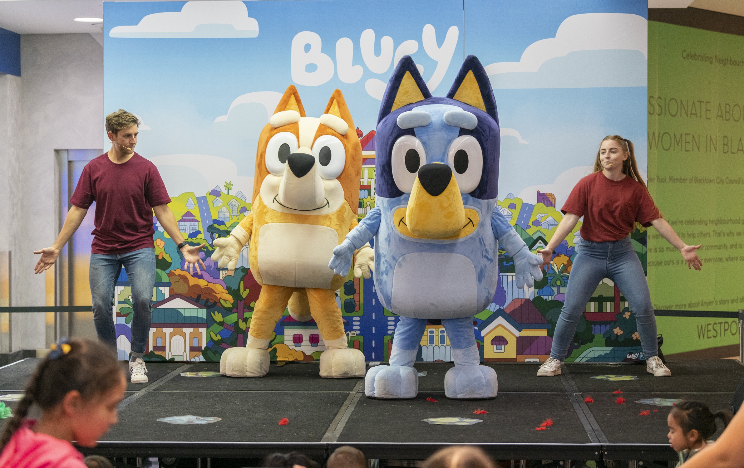 Bluey and Bingo on stage.