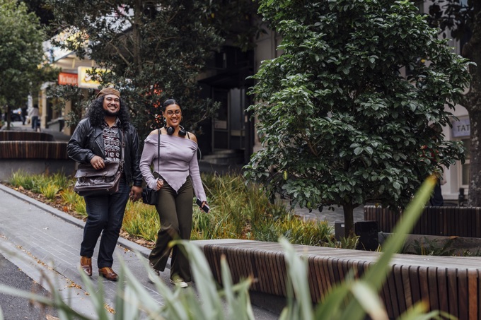 Man and woman walking up Victoria St