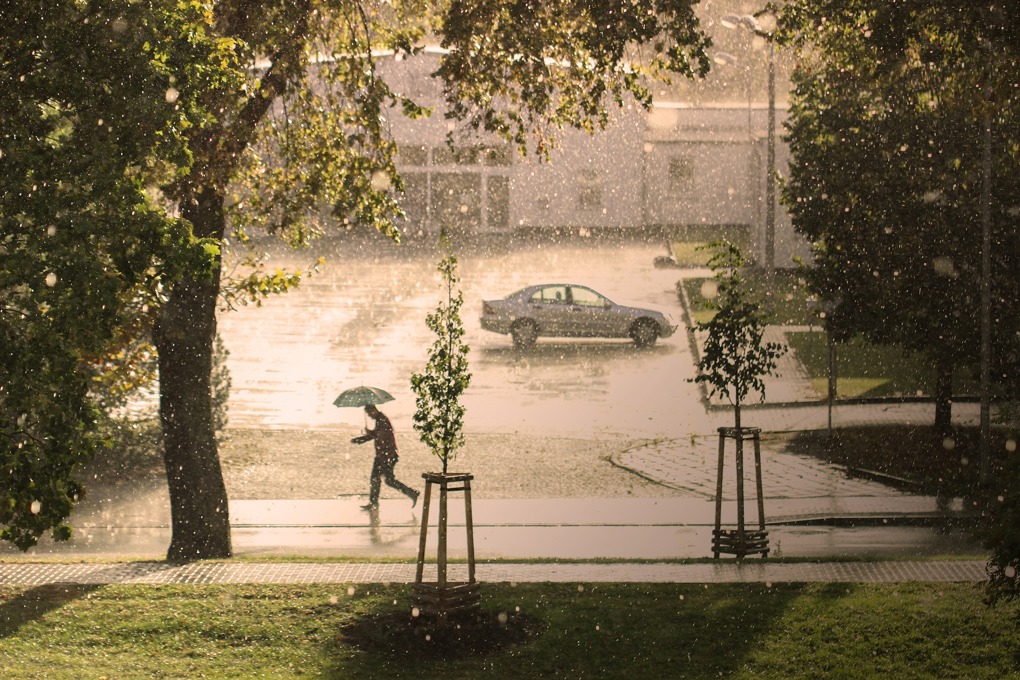 Man With Umbrella In Rain Stock Image